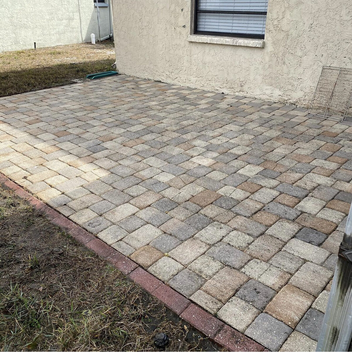 Clean, restored paver patio after pressure washing by Strong Valley Multi Services in Tampa, FL