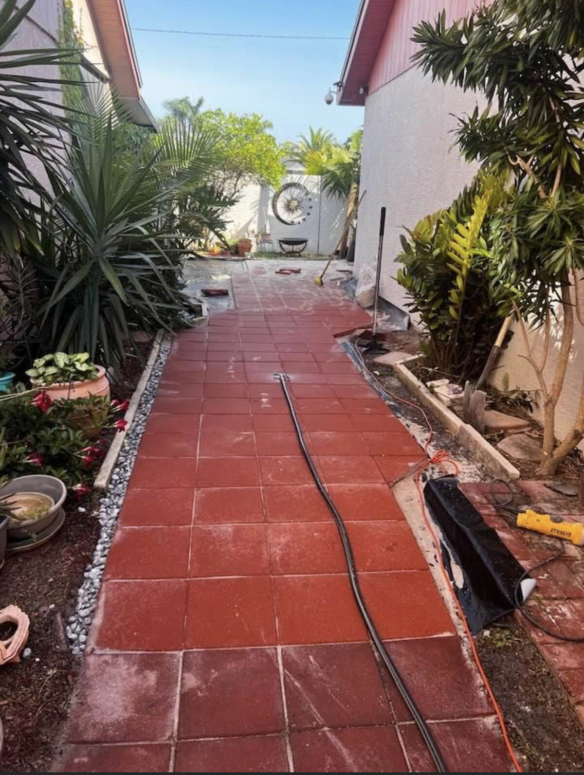 Bright, clean red brick walkway after pressure washing by Strong Valley Multi Services in Tampa, FL